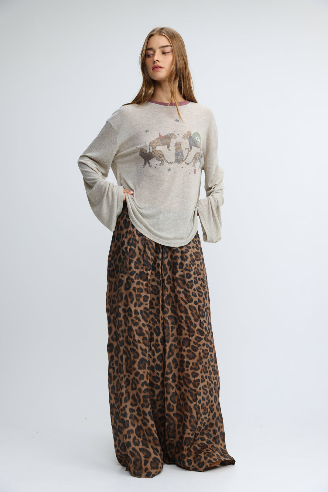 Off-white long-sleeved jungle grey shirt with whimsical animal print across the chest shown from the front