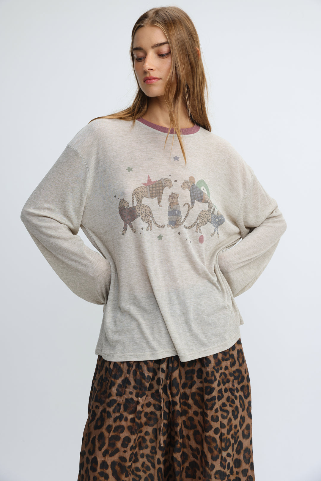 Jungle grey long-sleeved sweatshirt with a playful graphic of illustrated leopards and stars on the front
