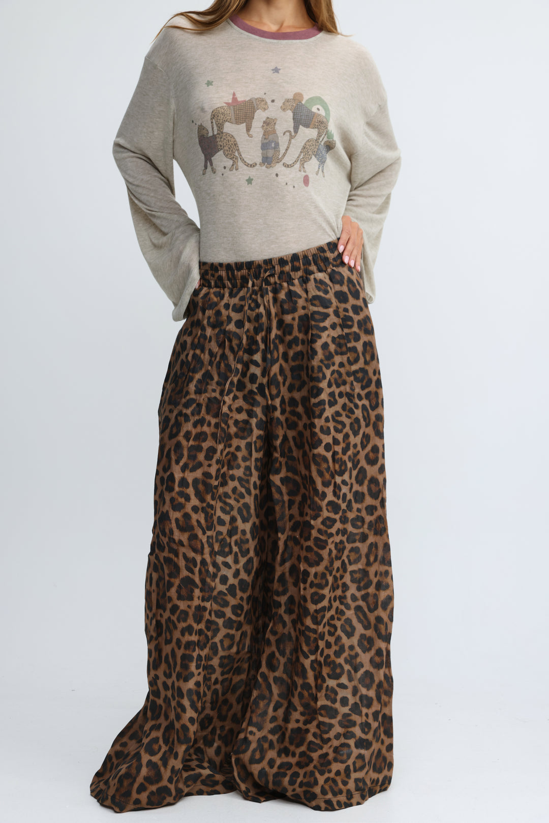 A flowing wide-leg skirt in rich brown and black leopard print shown from the front