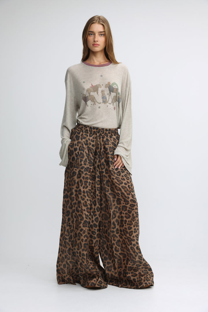 A front view of a flowing, wide-leg leopard-print skirt in earthy brown and black tones called tender leopard wide bottoms