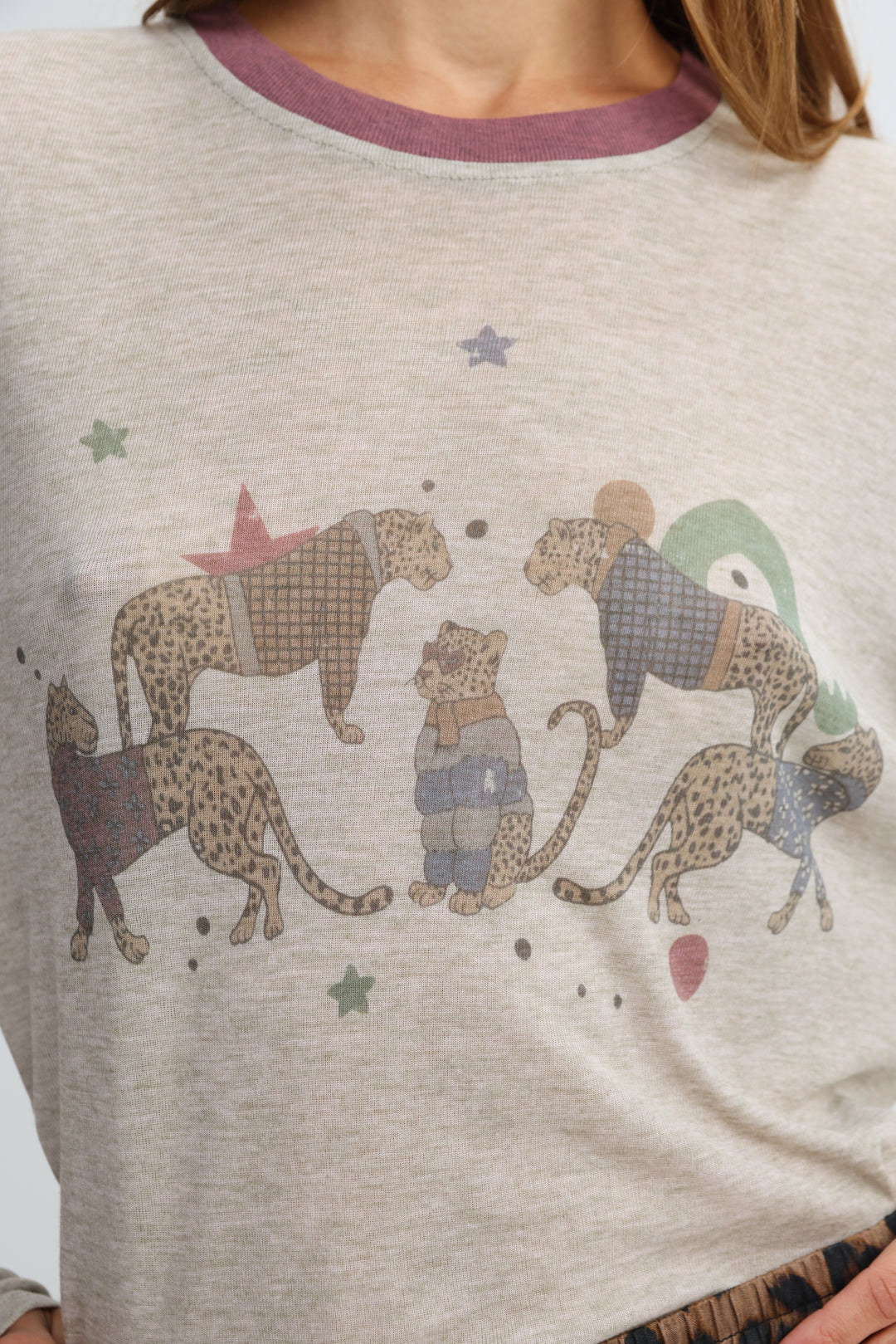 Heather gray long-sleeved jungle grey shirt with purple ribbed crew neck and cartoon cheetahs with stars on front