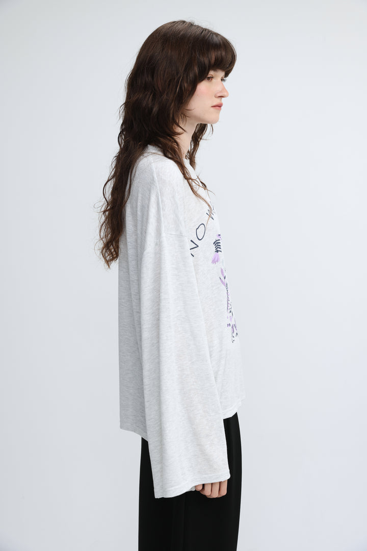 NML grey shirt heather gray long-sleeved t-shirt with subtle floral and text graphic on the side