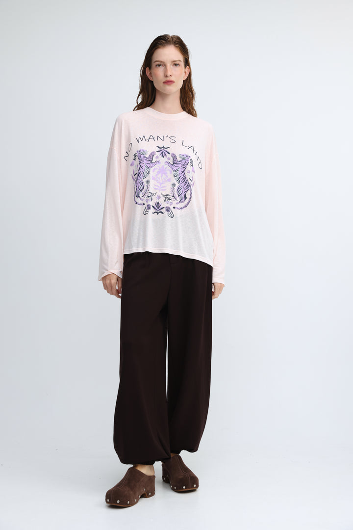 Nml pink shirt soft pink long-sleeved tee with a purple and white crest graphic and no mans land text on front