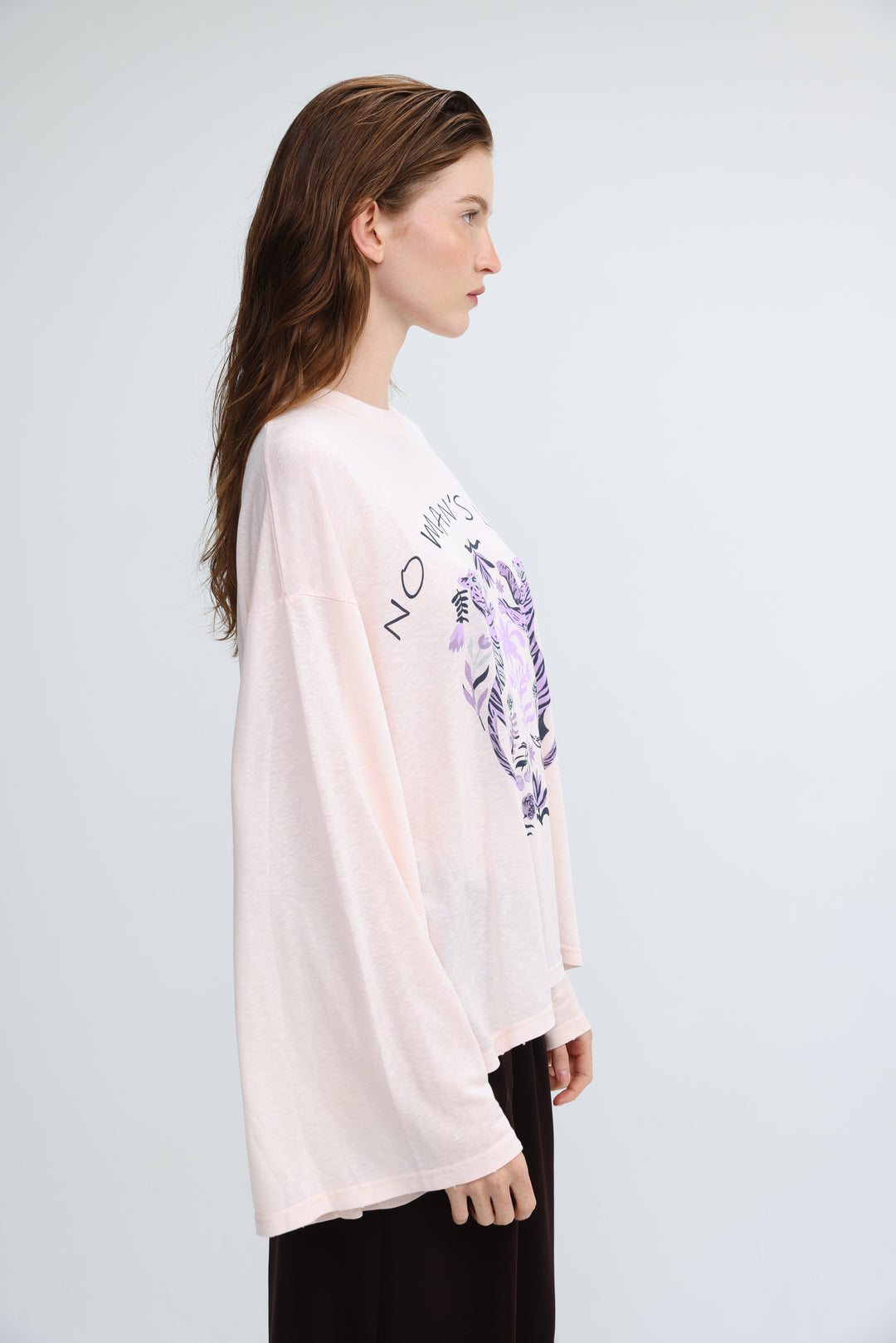 Nml pink shirt blush pink long-sleeved tee with purple tiger graphic and no ways text on the chest front view