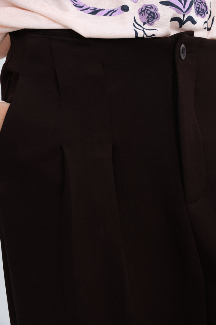 Black high-waisted tailored trousers with subtle pleats from everything brown bottoms shown from the front