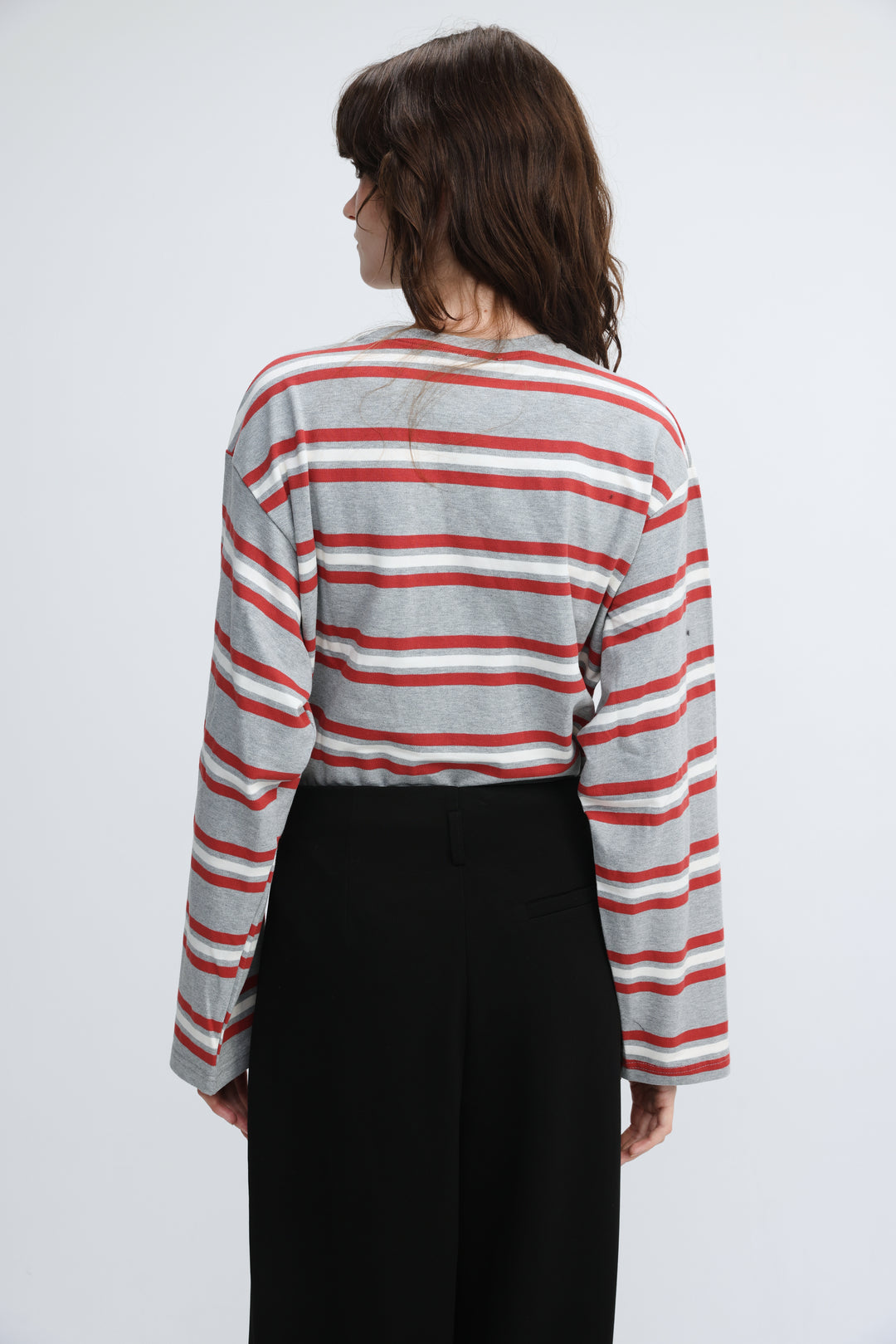 A gray and red horizontally striped long-sleeved shirt with a relaxed fit shown from the front