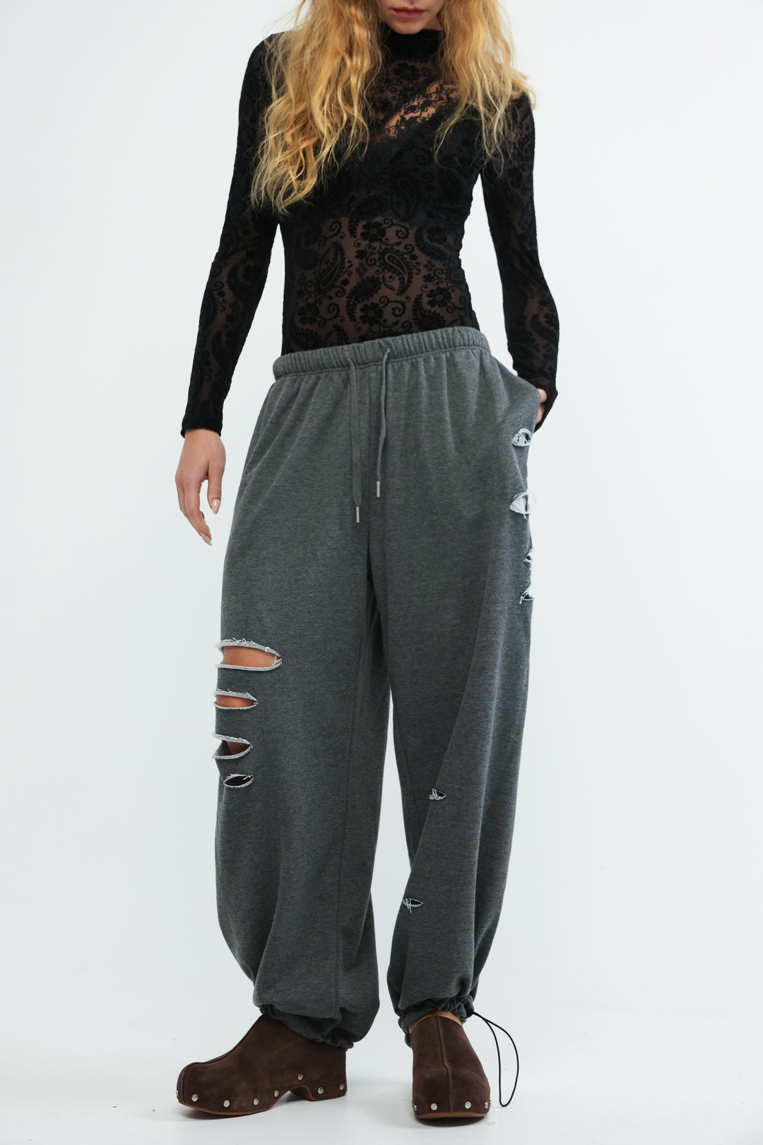 Scissors dark grey joggers with elastic waistband drawstring and distressed patches along the leg front view