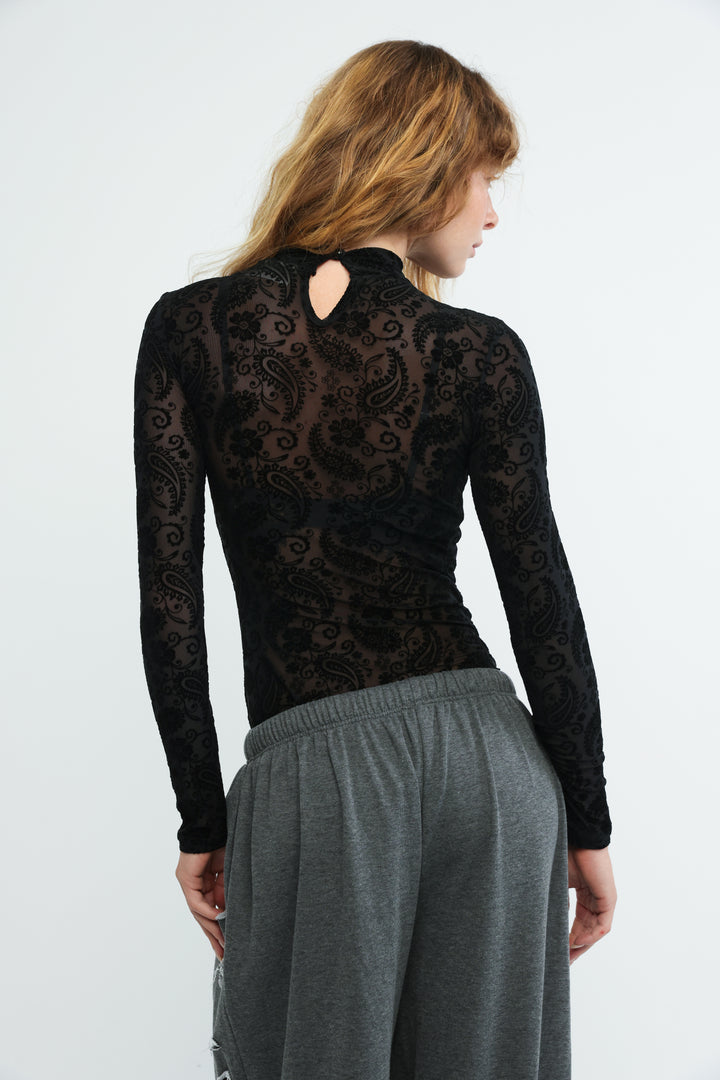 Claim black bodysuit featuring long sleeves with black lace paisley pattern and keyhole back detail