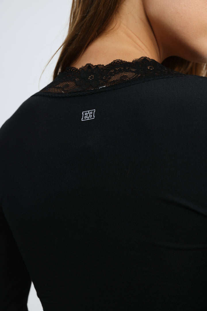 Mysterious black shirt long-sleeved top with delicate black lace trim at neckline and small white logo on back