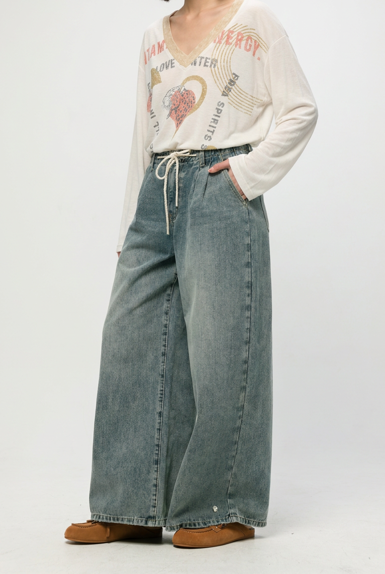 Wide-leg star 461 blue denim pants in faded blue wash with drawstring waistband shown from the front