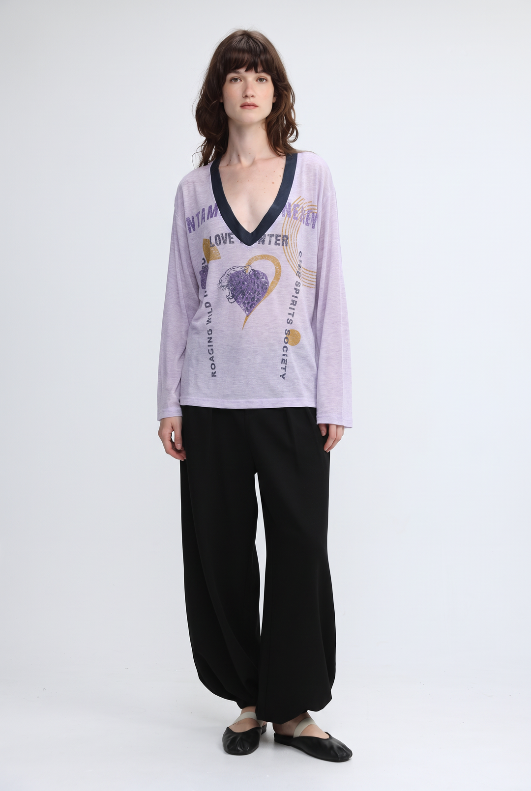 Lavender long-sleeved v-neck top with navy trim and jungle graphic print shown from the front