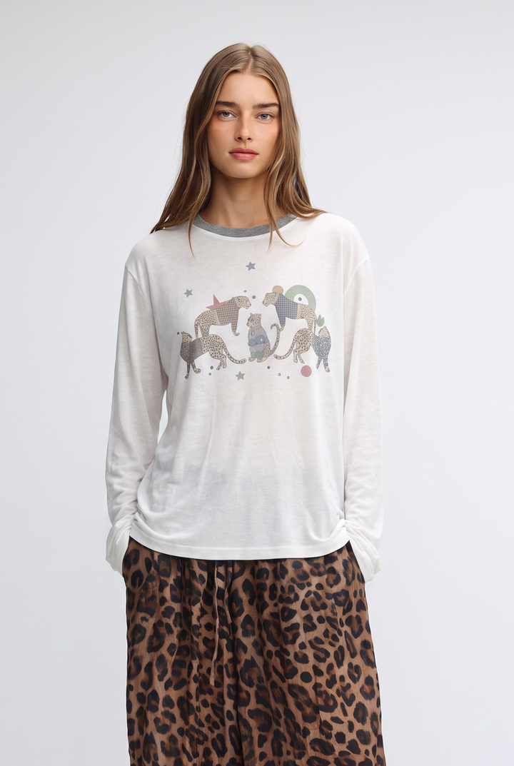 White long-sleeved jungle cream shirt with gray crew neck and whimsical cat graphic accented by small stars on front