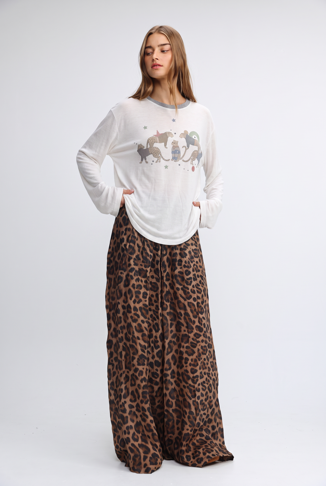 White long-sleeved jungle cream shirt with gray trim and whimsical animal print on front view