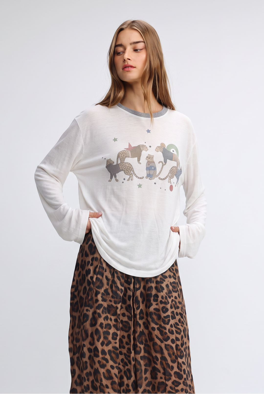White Jungle Cream Shirt long-sleeved top with gray crew neckline and whimsical cat graphic surrounded by stars front view
