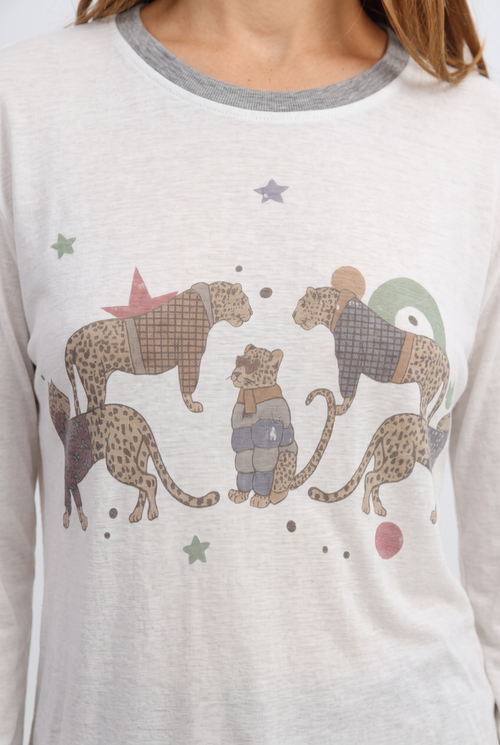 White long-sleeved pajama top jungle cream shirt with gray ribbed neckline and cartoon cheetah graphic on front