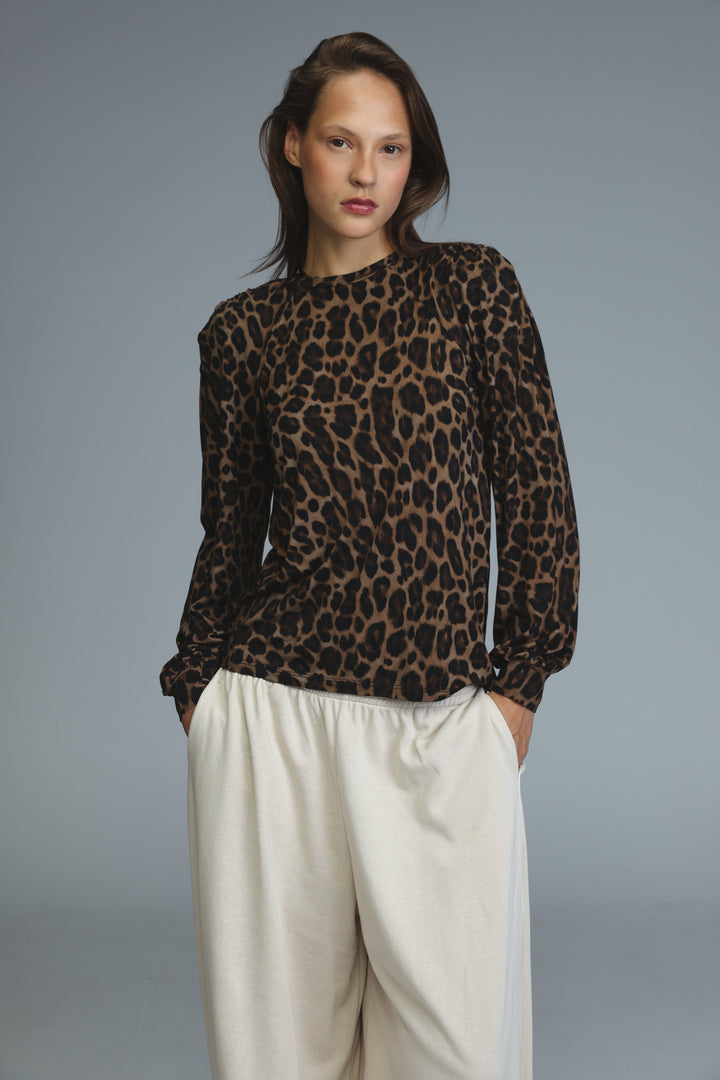 Lg leopard padded shirt showing a long-sleeved leopard-print blouse with a high neckline and gathered cuffs front view