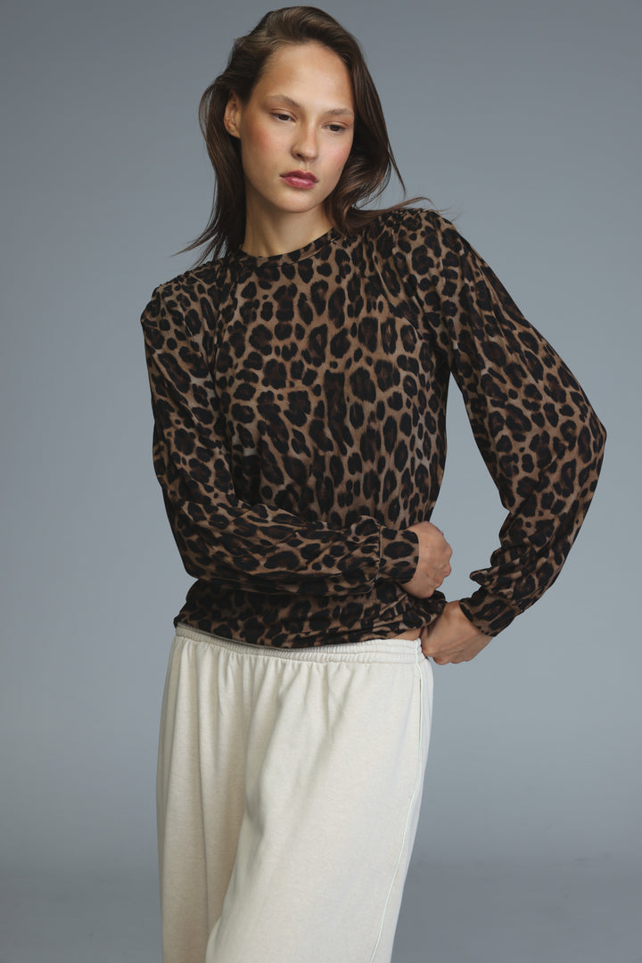 Lg leopard padded shirt showing a sheer long-sleeved leopard-print blouse with round neckline and ruched cuffs