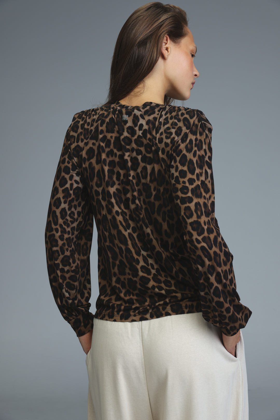 Lg leopard padded shirt is a long sleeve leopard-print blouse with a gathered neckline shown from the front