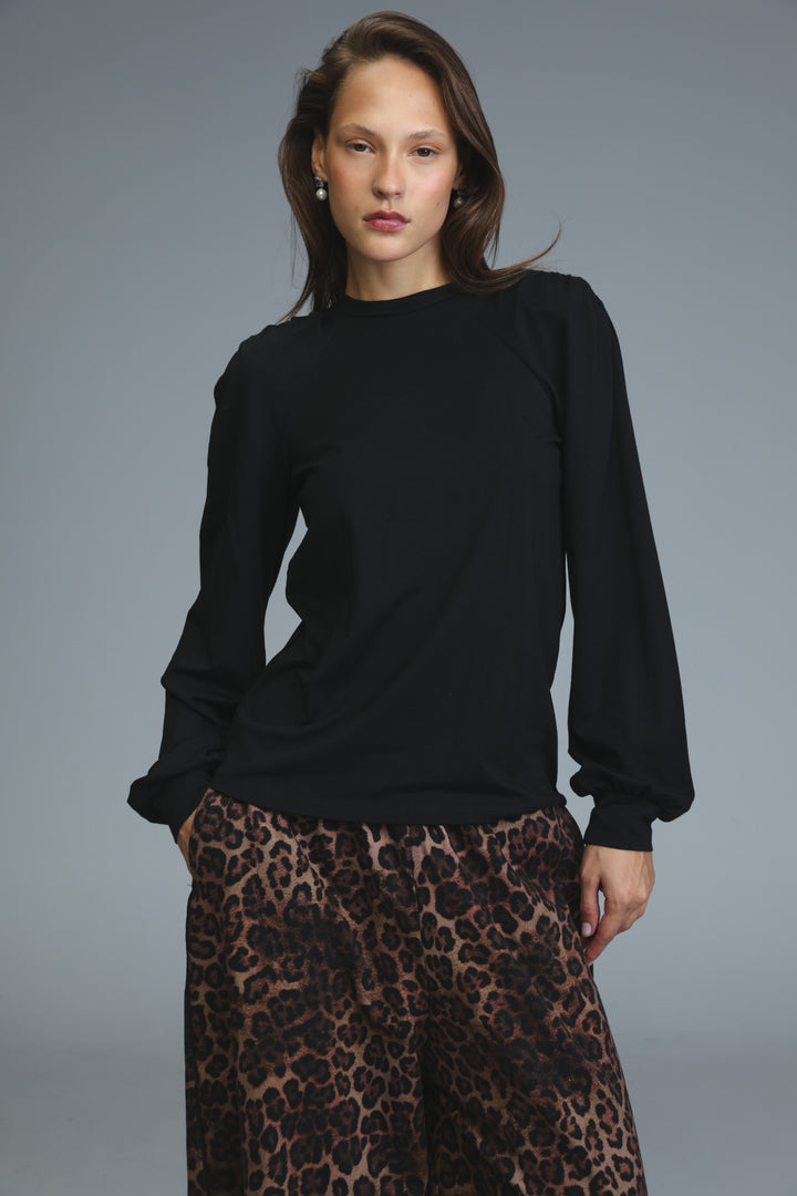 Lg black padded shirt long-sleeved top with puffed shoulders and ribbed cuffs shown from the front view