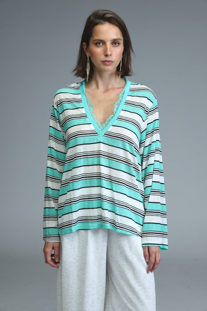 Glow mint striped women’s long-sleeved v-neck top with horizontal mint green white and black stripes front view
