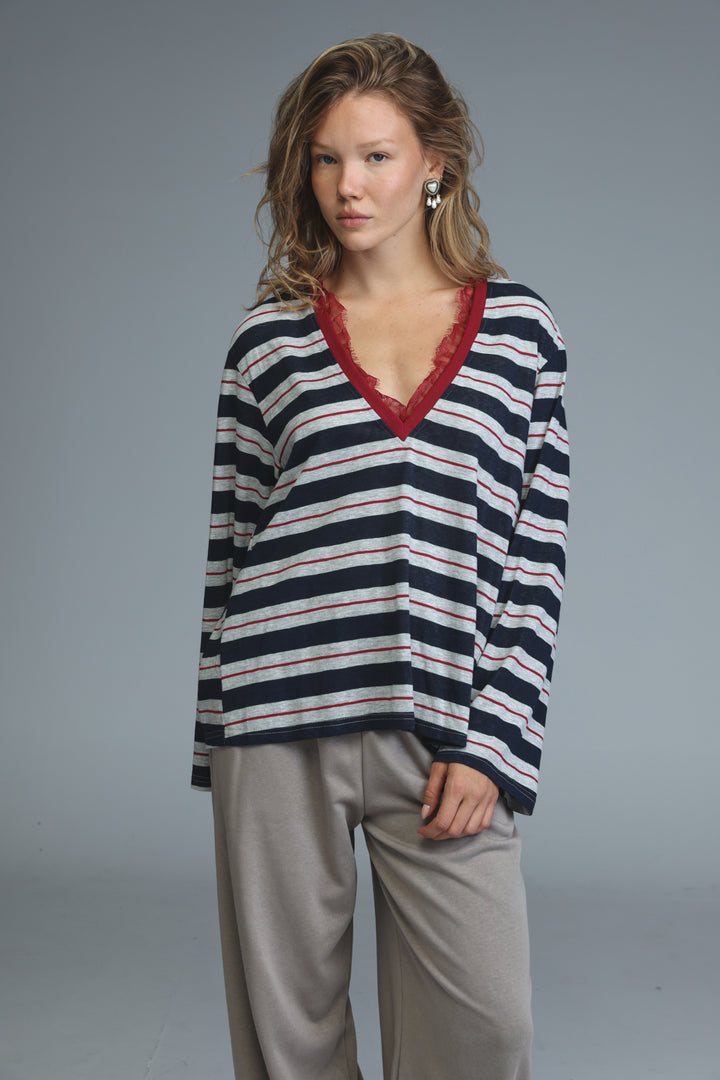 Glow blue striped shirt long-sleeved v-neck sweater with navy white and thin red stripes and red lace trim on front neckline