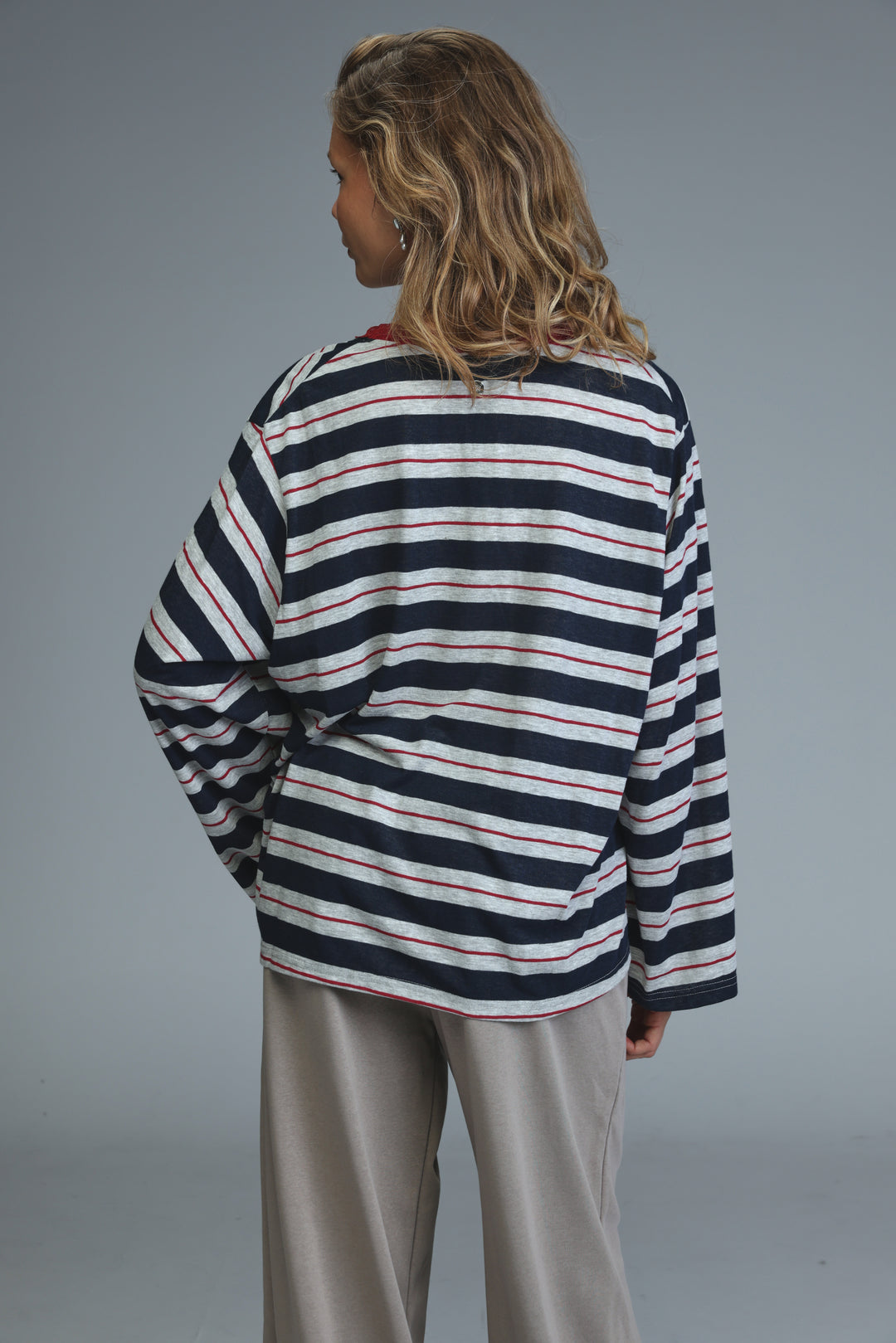 Glow blue striped shirt featuring navy white and red horizontal stripes with long sleeves and a relaxed fit front view