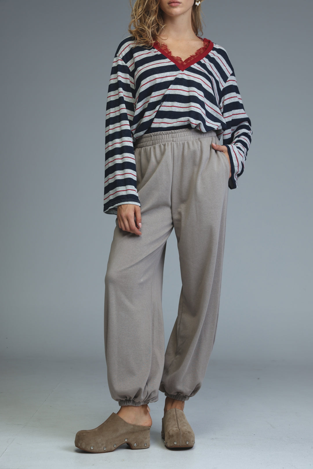 Try beige joggers loose-fitting light gray drawstring pants with elastic cuffs shown from the front