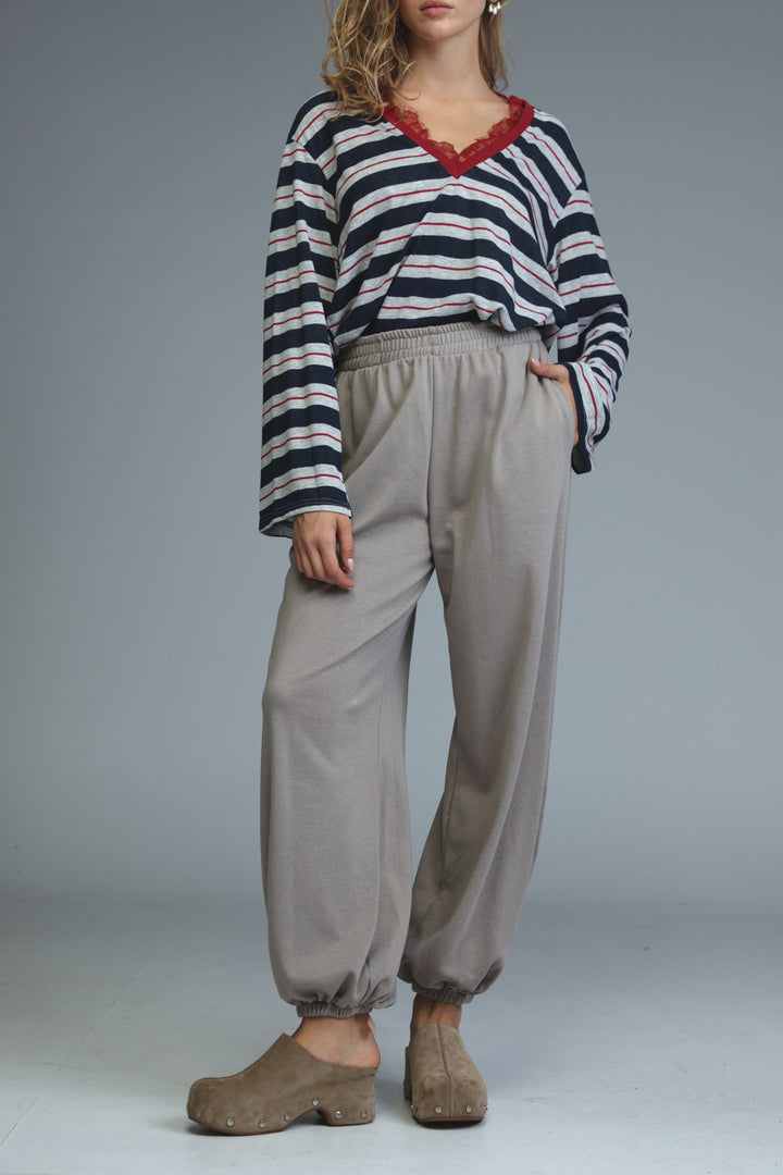 Try beige joggers loose-fitting light gray drawstring pants with elastic cuffs shown from the front