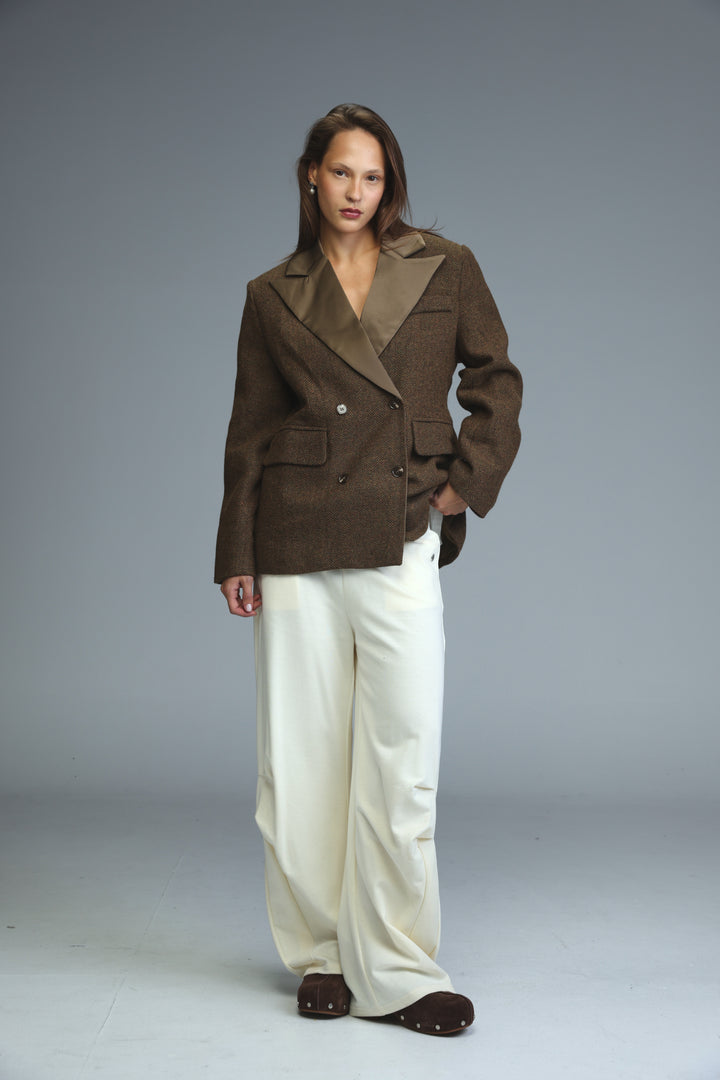 Penthouse brown double-breasted blazer with structured silhouette and contrasting lighter brown lapels, front view