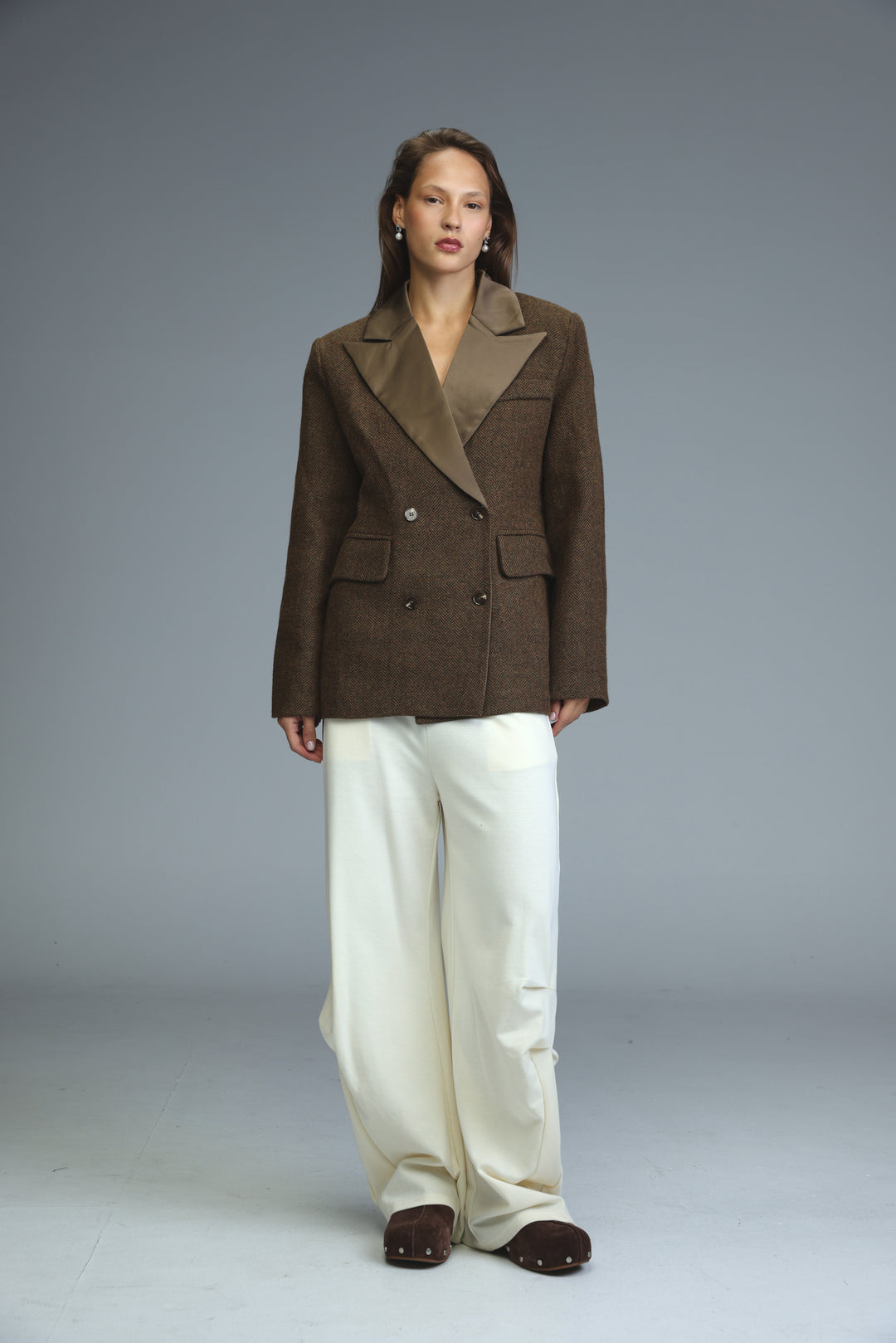 Penthouse brown double-breasted blazer with contrasting tan satin lapel and two front pockets shown from the front