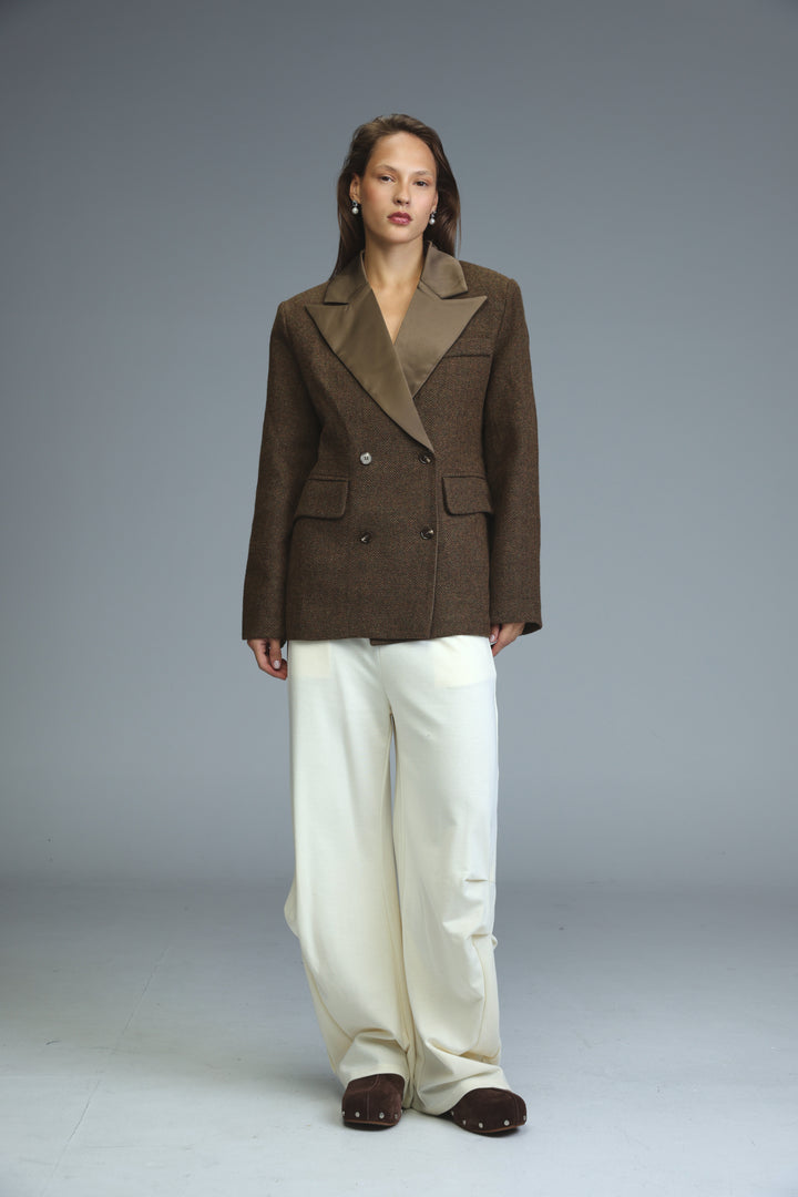 Penthouse brown double-breasted blazer with contrasting tan satin lapel and two front pockets shown from the front