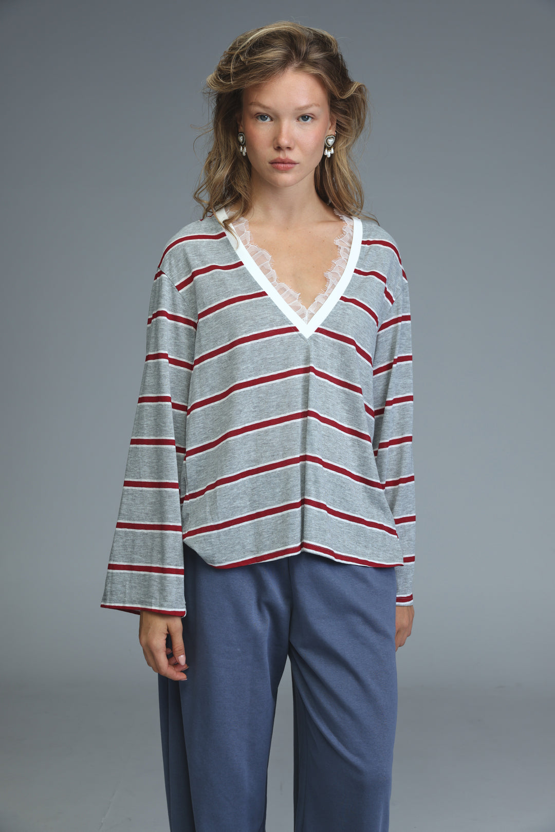 Glow grey striped shirt with gray and red horizontal stripes and white lace-trimmed v-neckline front view