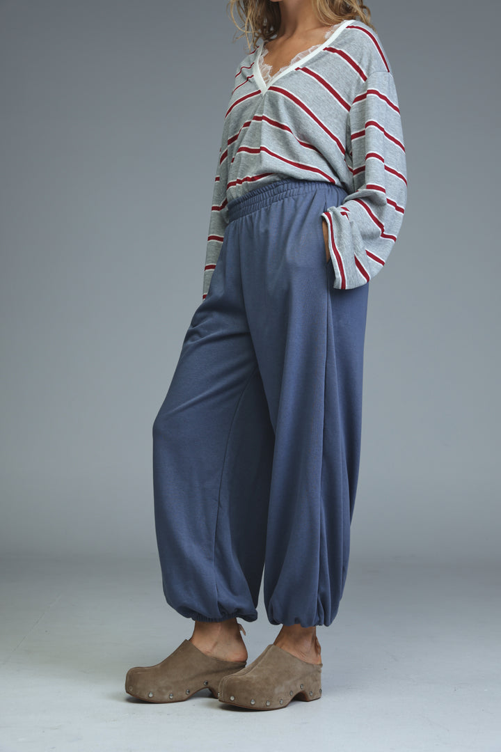 Blue elastic-waist wide-leg pants with a relaxed flowing silhouette shown from the front
