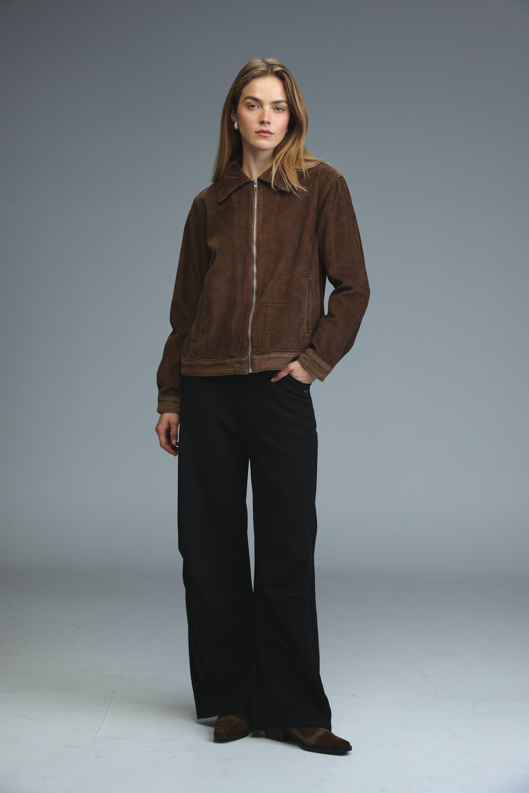 Brown bomber jacket with full-length zipper and ribbed cuffs shown from the front