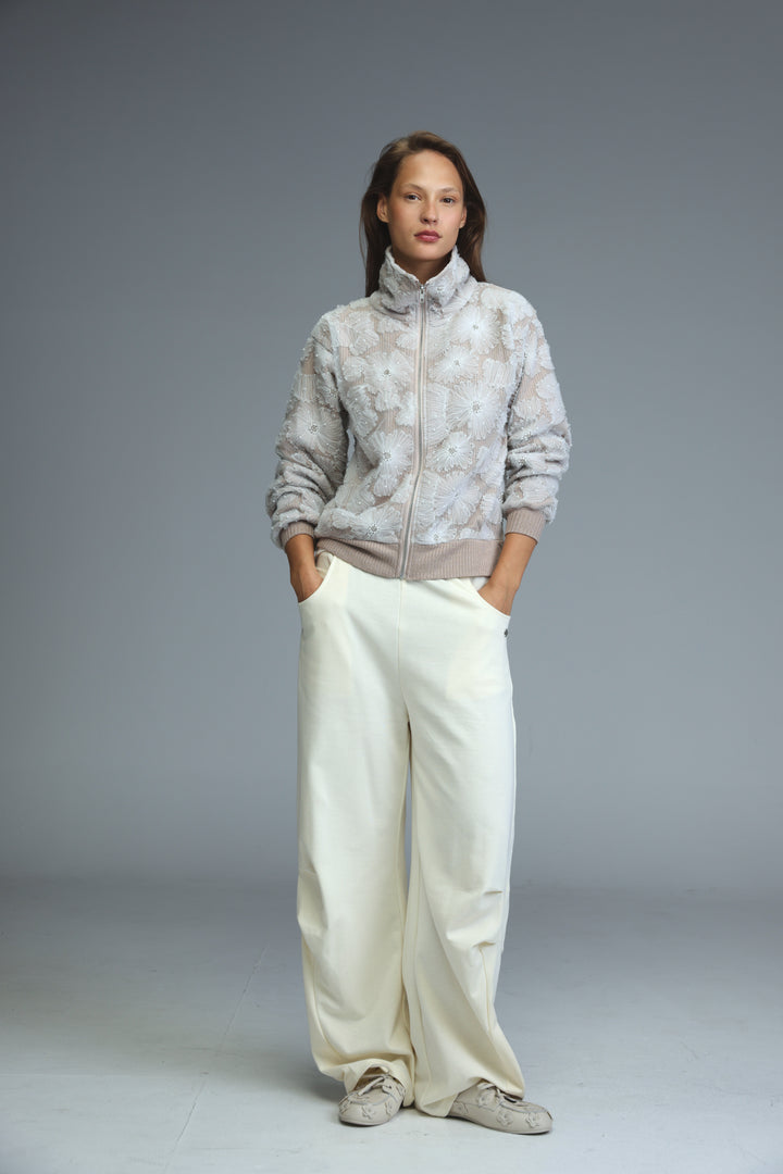 Light gray blossom stone jacket zip-up with subtle floral embroidery and ribbed cuffs shown from the front