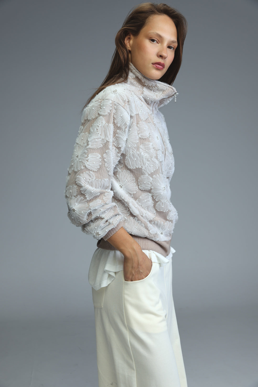 White blossom stone bomber jacket with floral embroidery and shimmering embellishments shown from the front