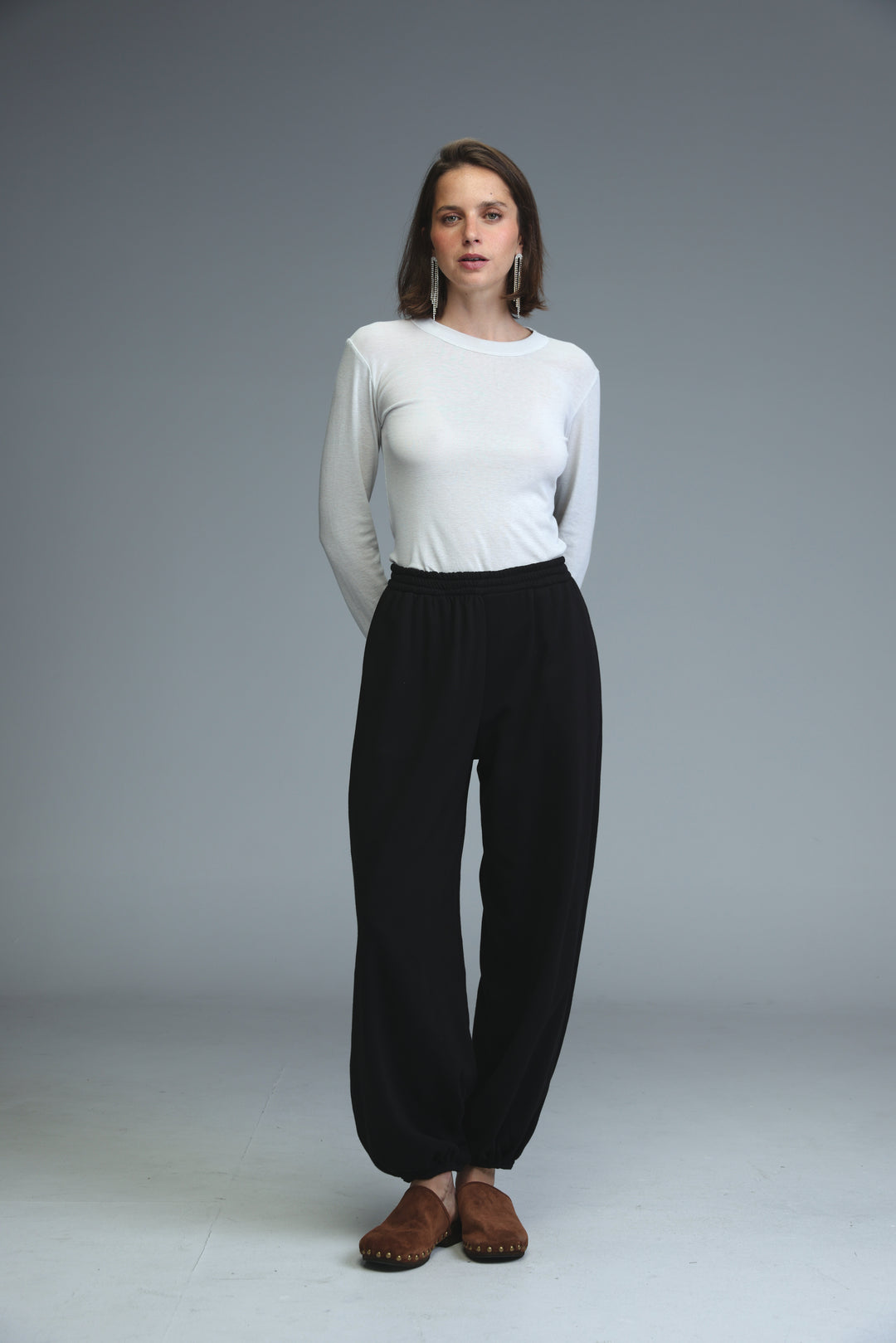 Black wide-leg joggers with a relaxed flowing silhouette shown from the front