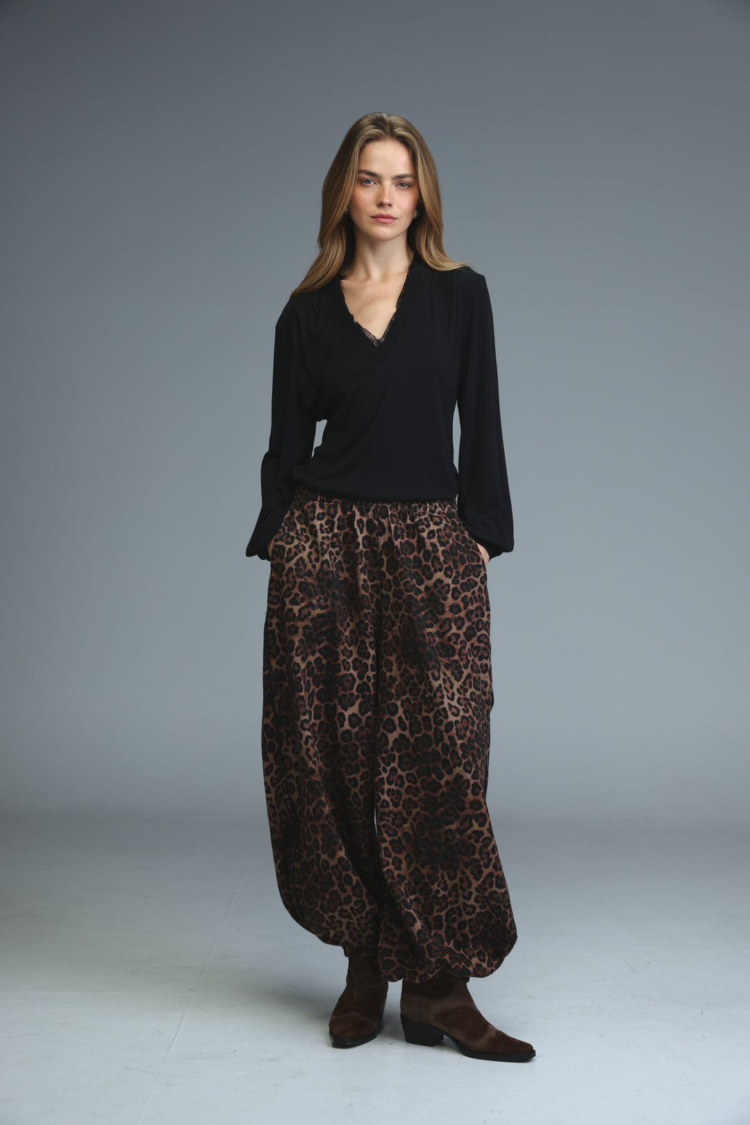 Brown leopard-print wide-leg pants with loose fit and soft flowing fabric shown from the front