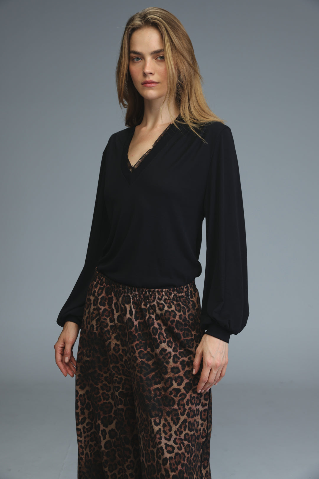 Black marry shirt long-sleeved blouse with v-neckline and subtle lace trim at collar shown from the front view