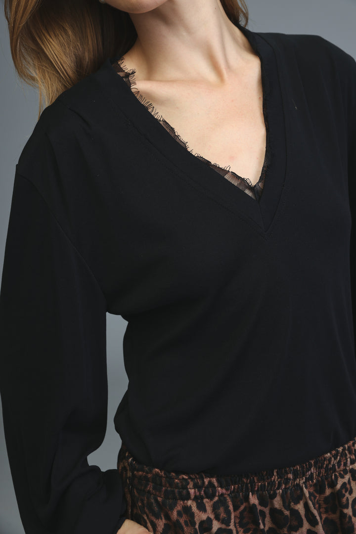 Black long-sleeved Marry blouse with v-neckline and delicate lace trim along the edge shown from the front