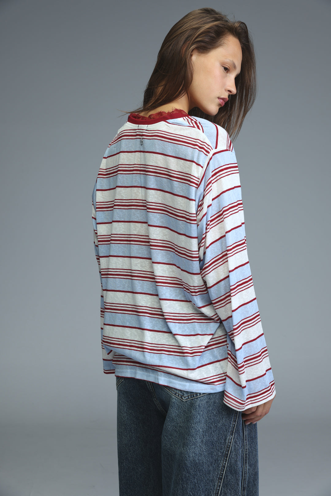 Long-sleeved glow red striped shirt with horizontal light blue white and maroon bands and red lace-trimmed neckline