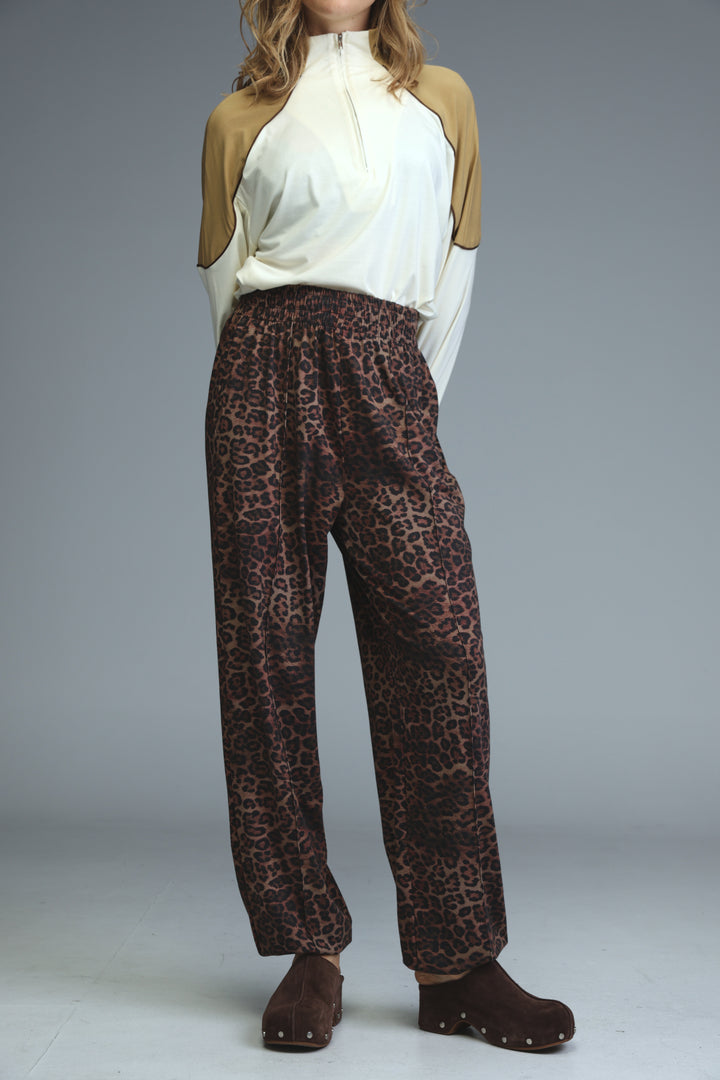 Brown leopard-print high-waisted joggers with relaxed fit and elastic waistband shown from the front angle