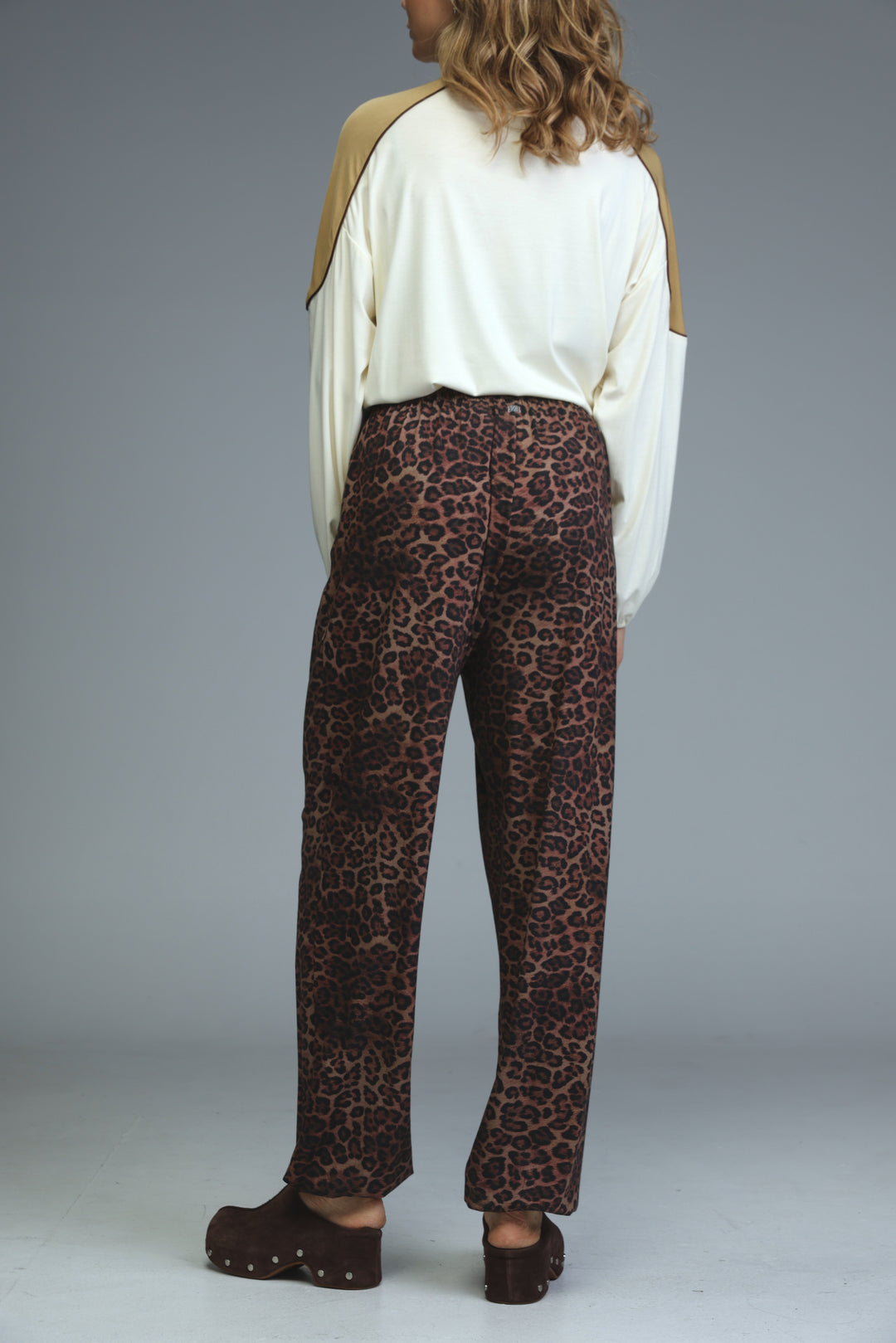 Brown leopard-print joggers with relaxed fit and high waist shown from the front