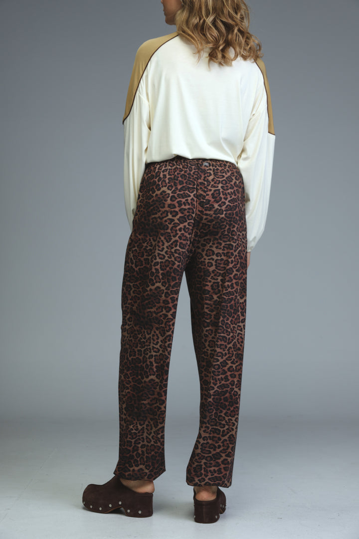 Brown leopard-print joggers with relaxed fit and high waist shown from the front