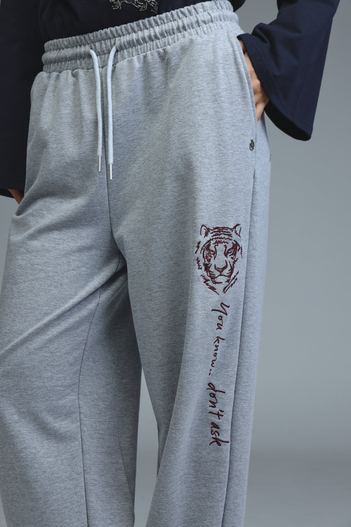 Iconic grey joggers with gray tiger-themed embroidered design and drawstring waistband shown from the front