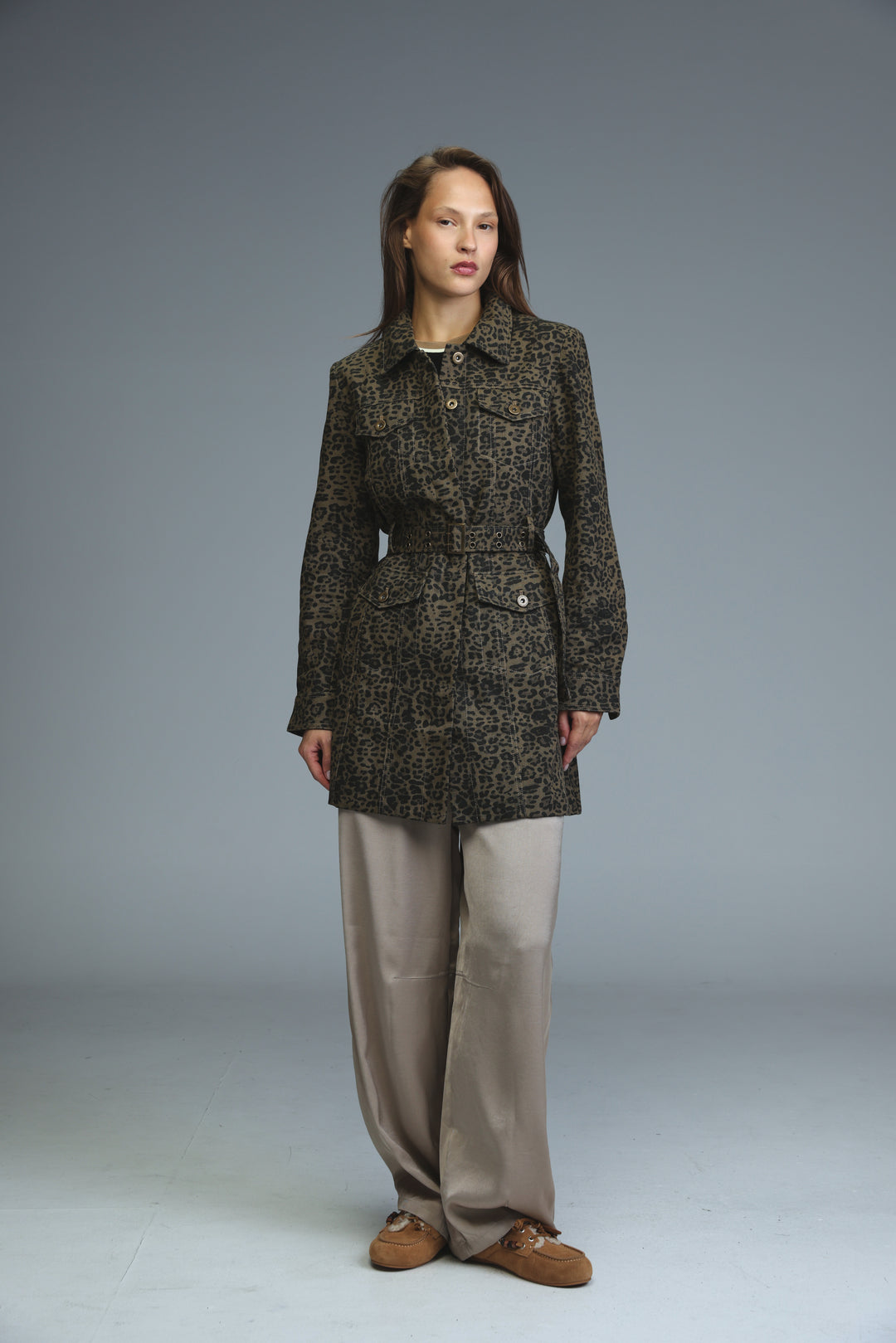Dark olive and black leopard-print trench coat with belted waist buttoned front and two flap pockets shown from front