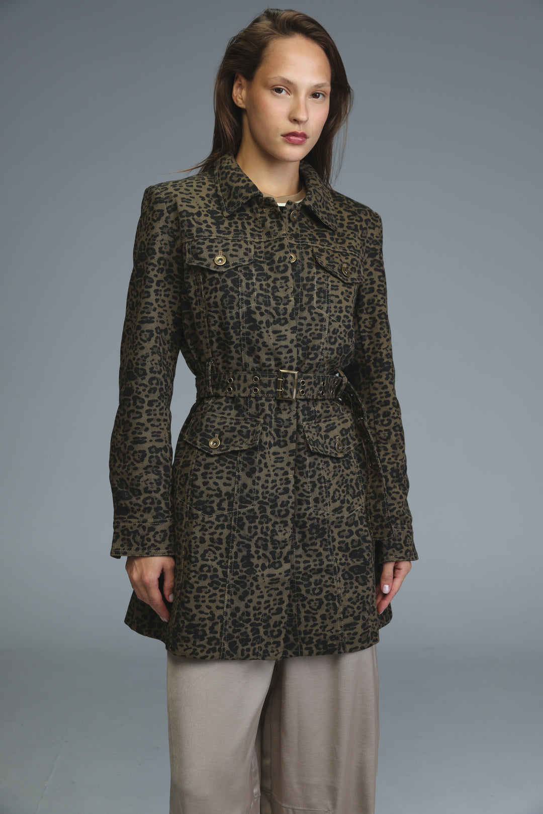 A dark olive and black leopard-print trench coat with belted waist, buttoned front, and flap pockets shown from front