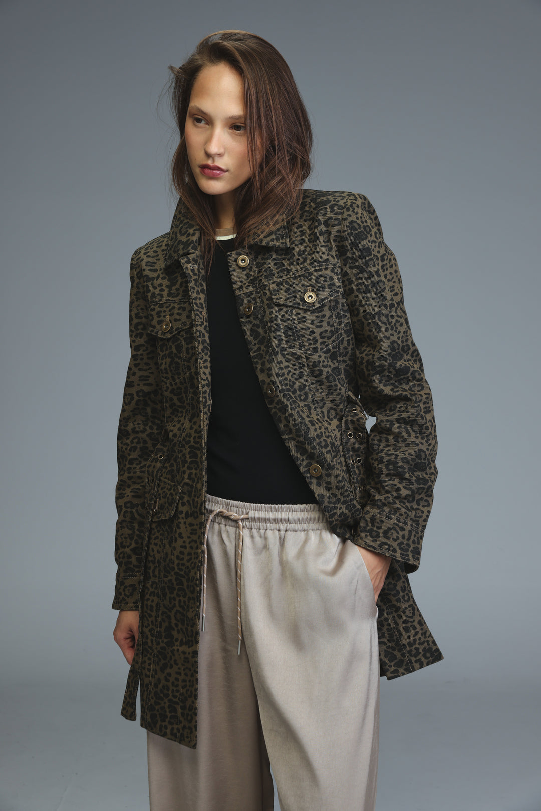 Dark olive and black leopard-print utility jacket with gold-tone buttons shown from the front