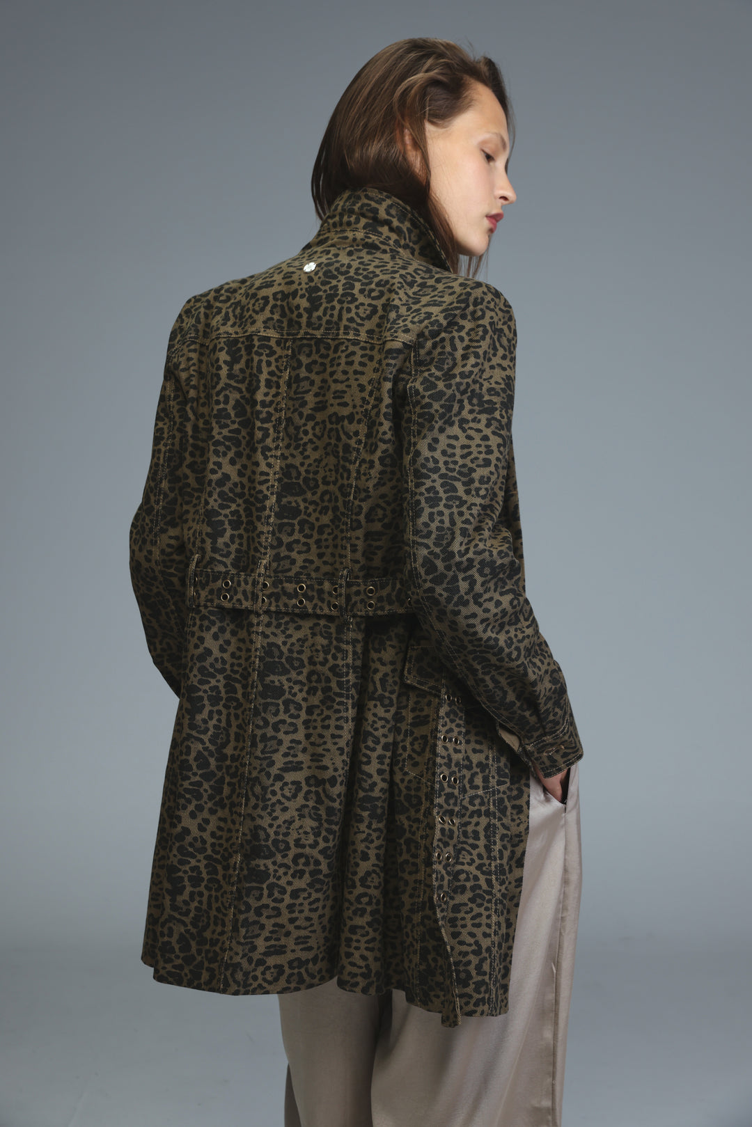 Olive green and black leopard-print denim trench coat with belted waist shown from the front