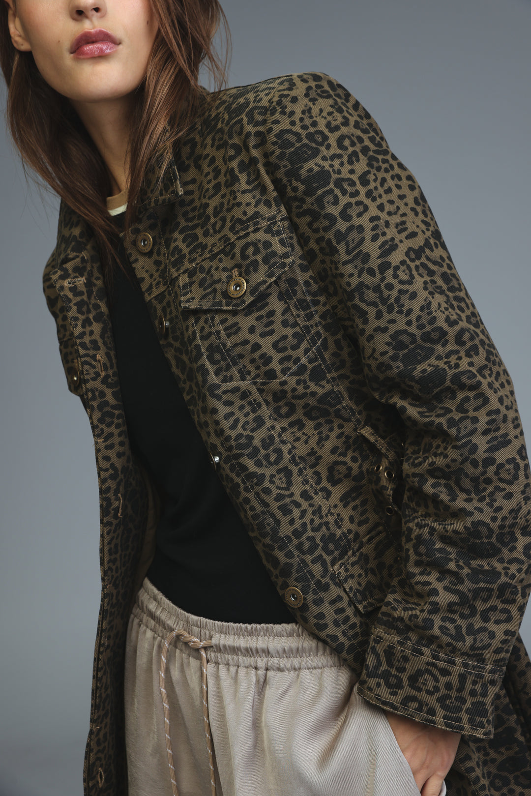 Olive and black leopard-print denim jacket with gold-tone buttons shown from the front